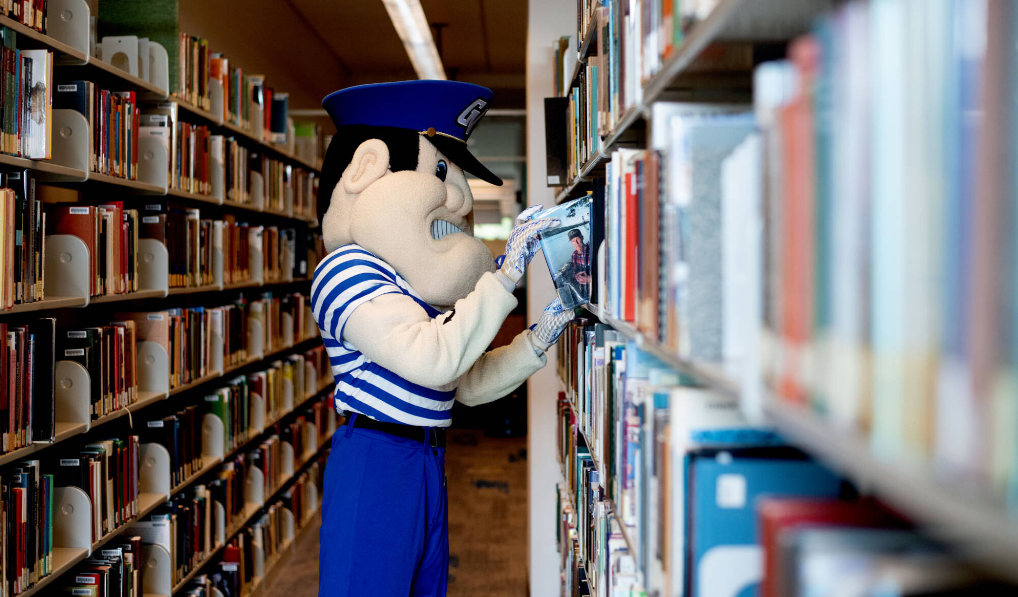 Louie the Laker going back to school and using the library
